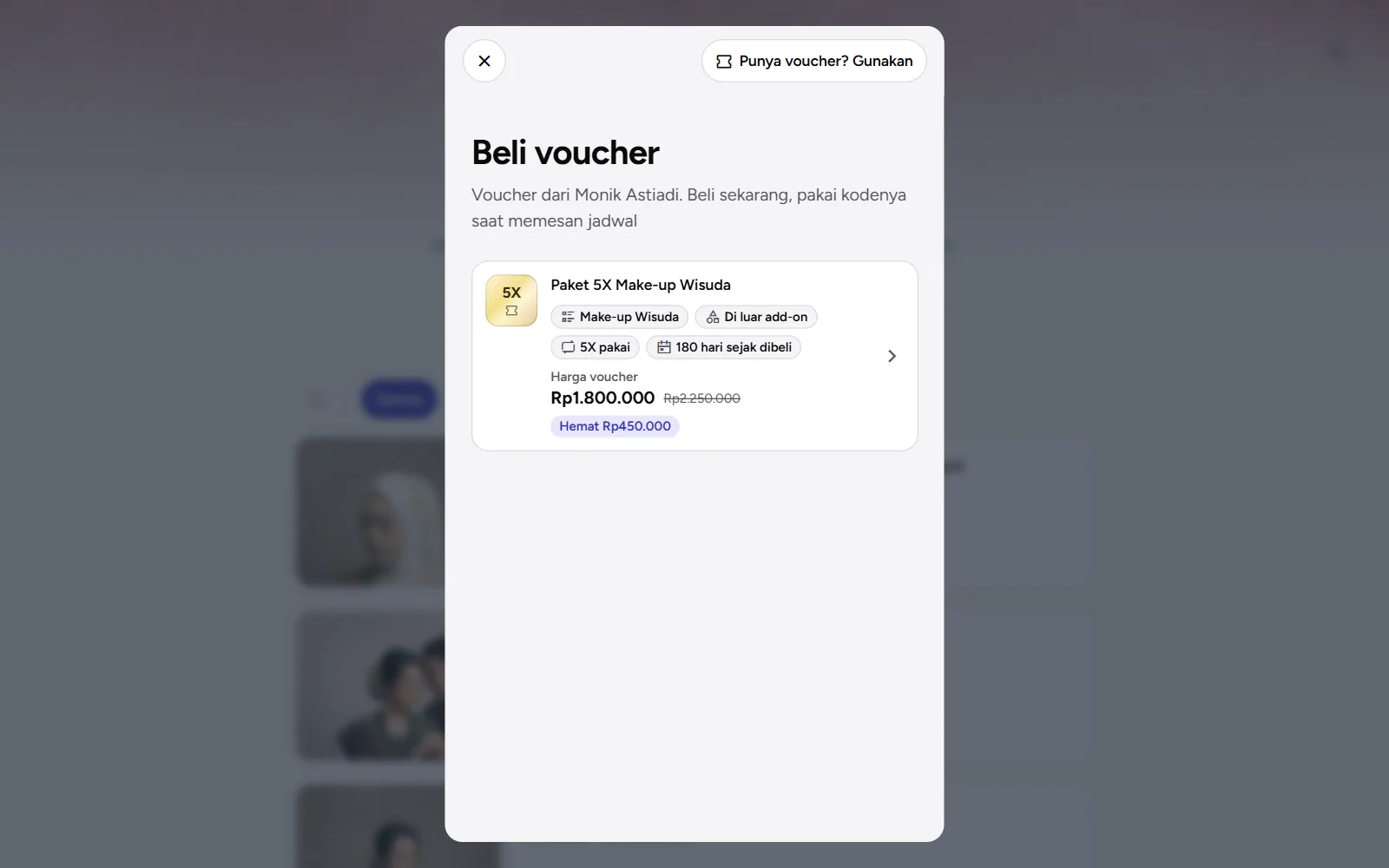 Tangkapan layar: daftar Beli voucher dengan tombol Punya voucher? Gunakan, tampilan desktop